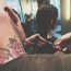 Felix cuts a customer's hair, tattoo, hairdressing, scissors